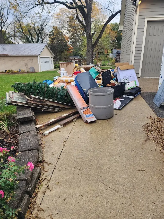 Dumpster being loaded with debris for 30 Yard Dumpster Rental in Woodridge